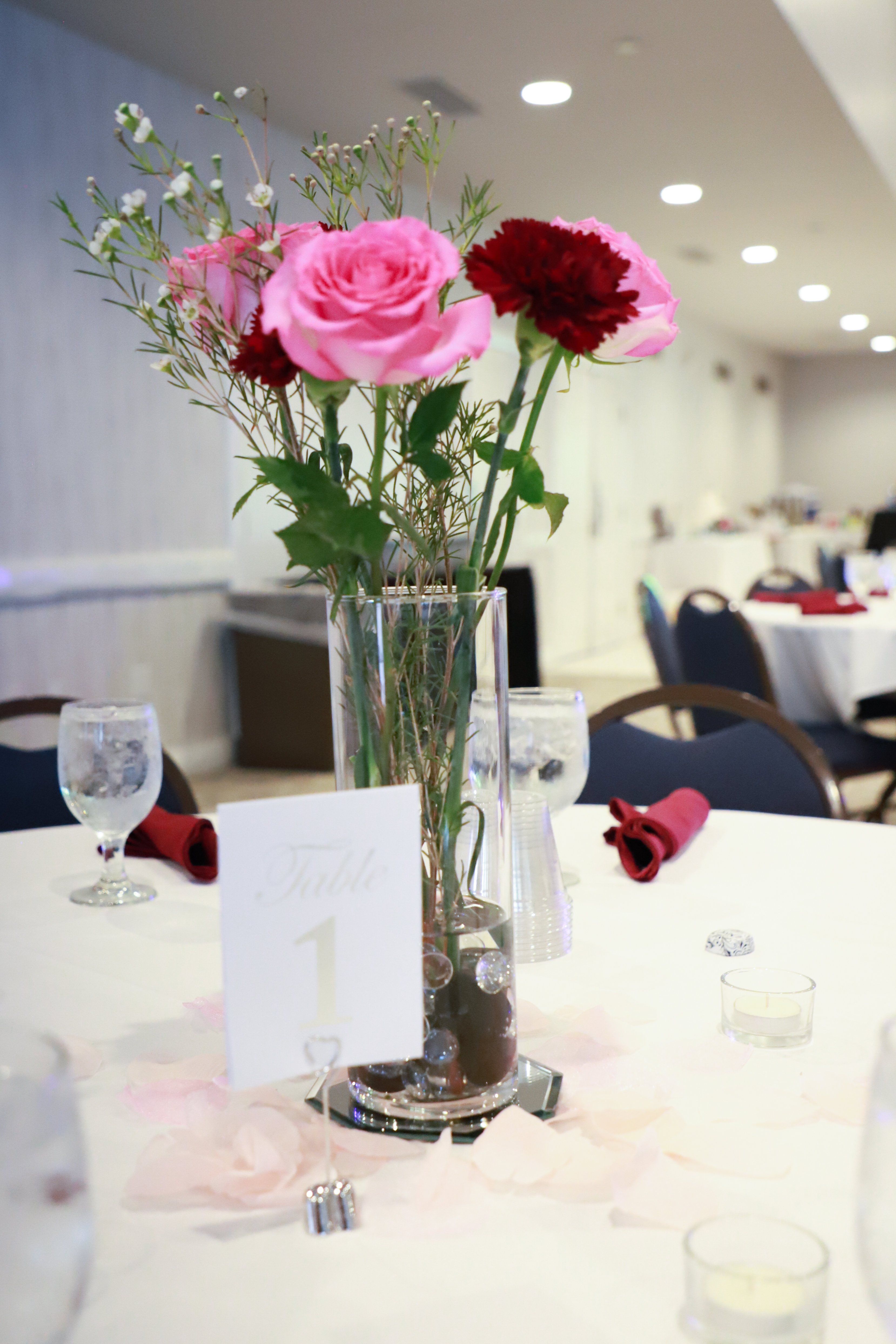 Banquet tables with rose centerpiece