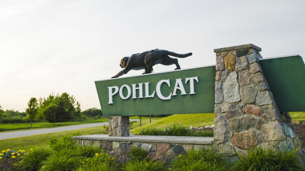 Pohlcat sign. A pohl cat statue is on top.